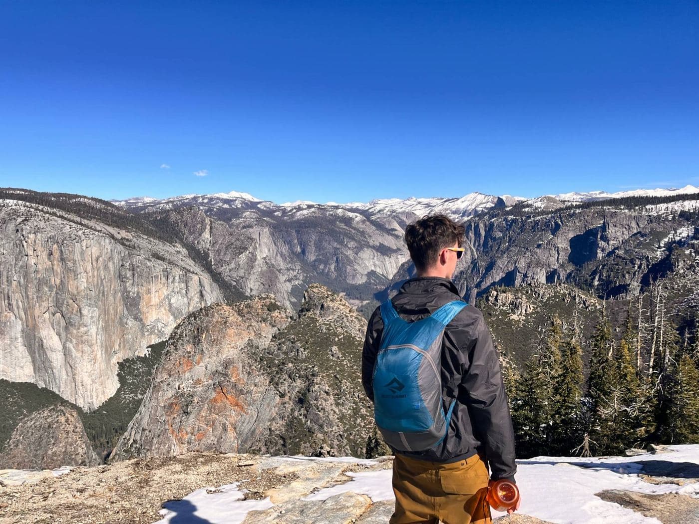 Leo looking out over Yosemite Valley and El Capitan on a winter hike